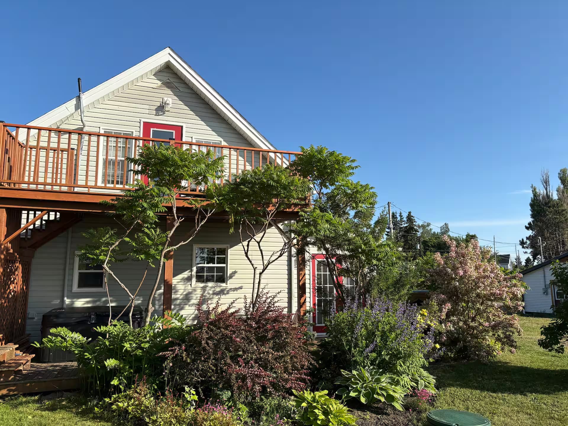 Cottage exterior with gardens and deck